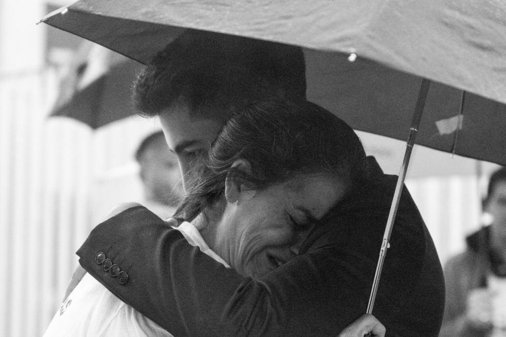 Blas Correa's mother and her son, Juan Segundo, embrace moments before the verdict that condemned those guilty of Blas's death was announced.